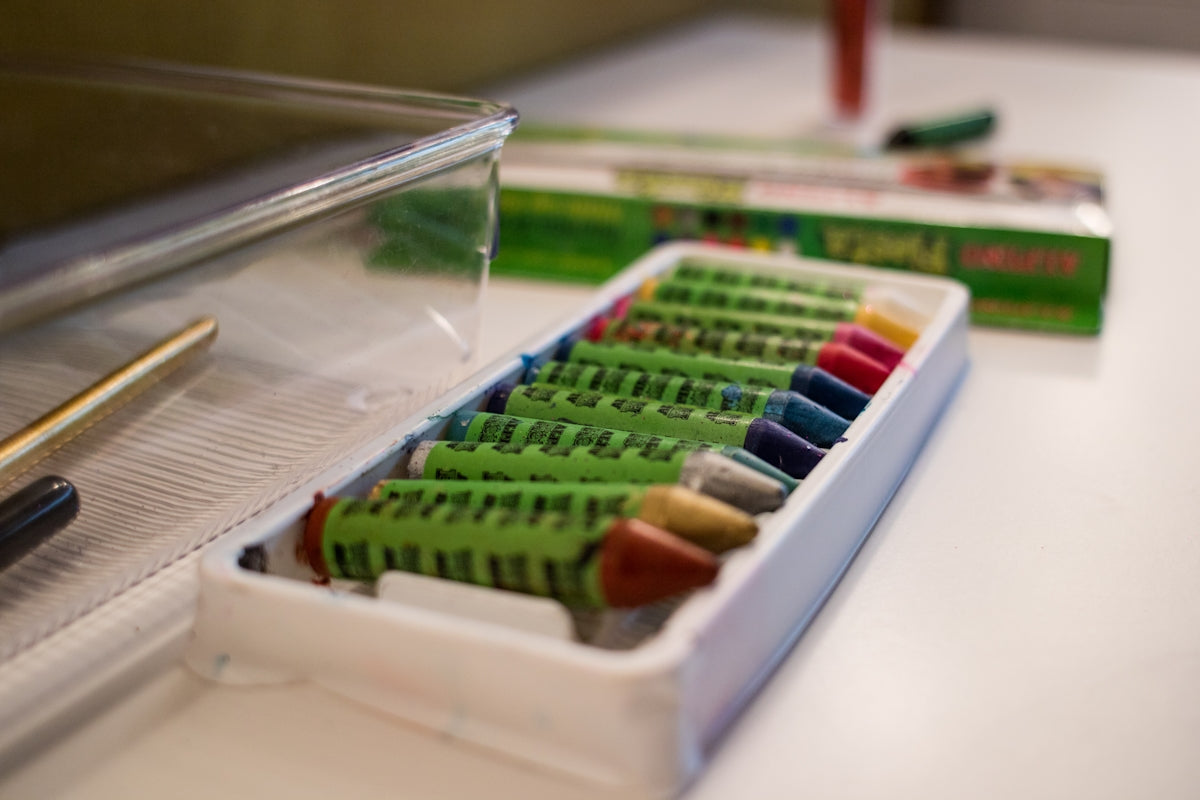 selective focus photo of assorted-color oil-pastel-based crayons