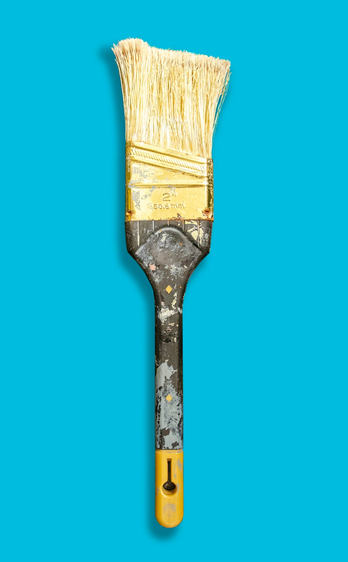 brown paint brush with blue background