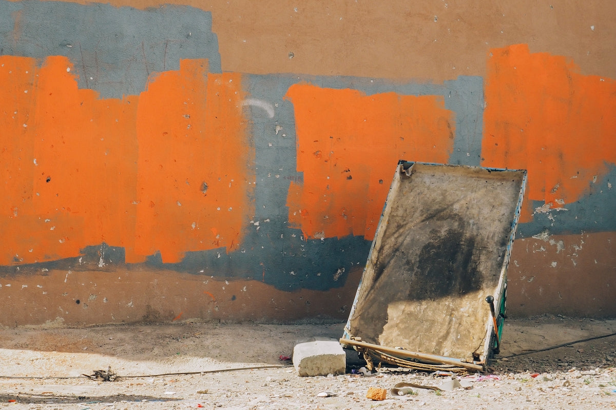 a picture frame sitting on the ground in front of a wall