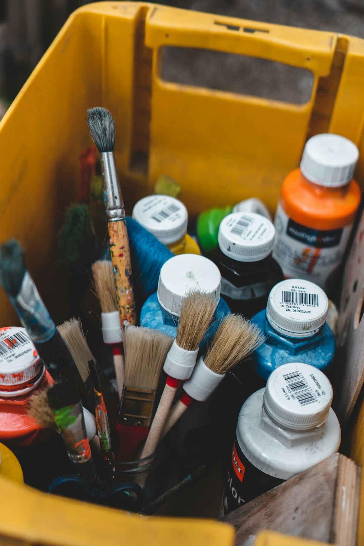 a yellow box with a variety of objects in it