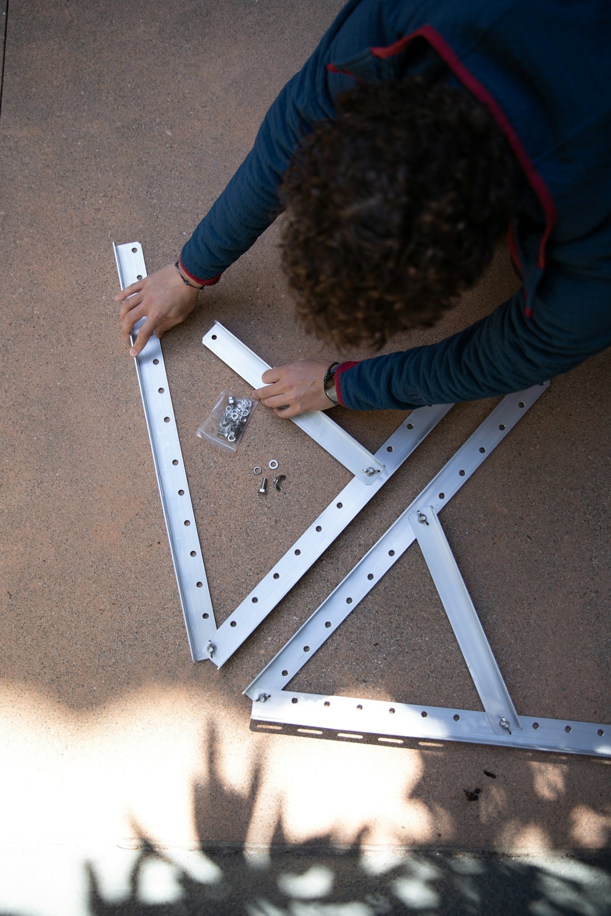 a person is working on a metal structure