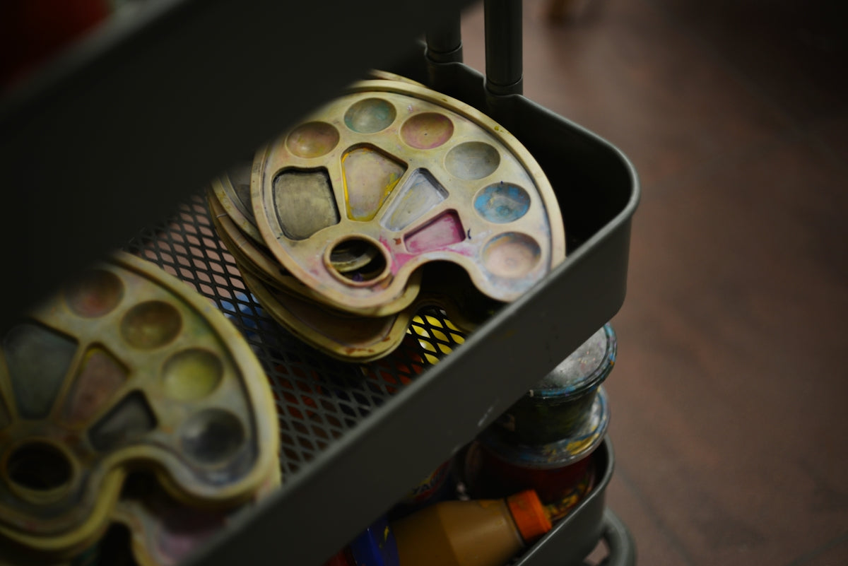 A metal container filled with lots of different items