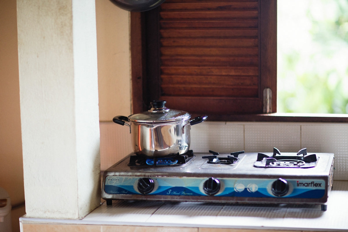a stove top with a pot on top of it