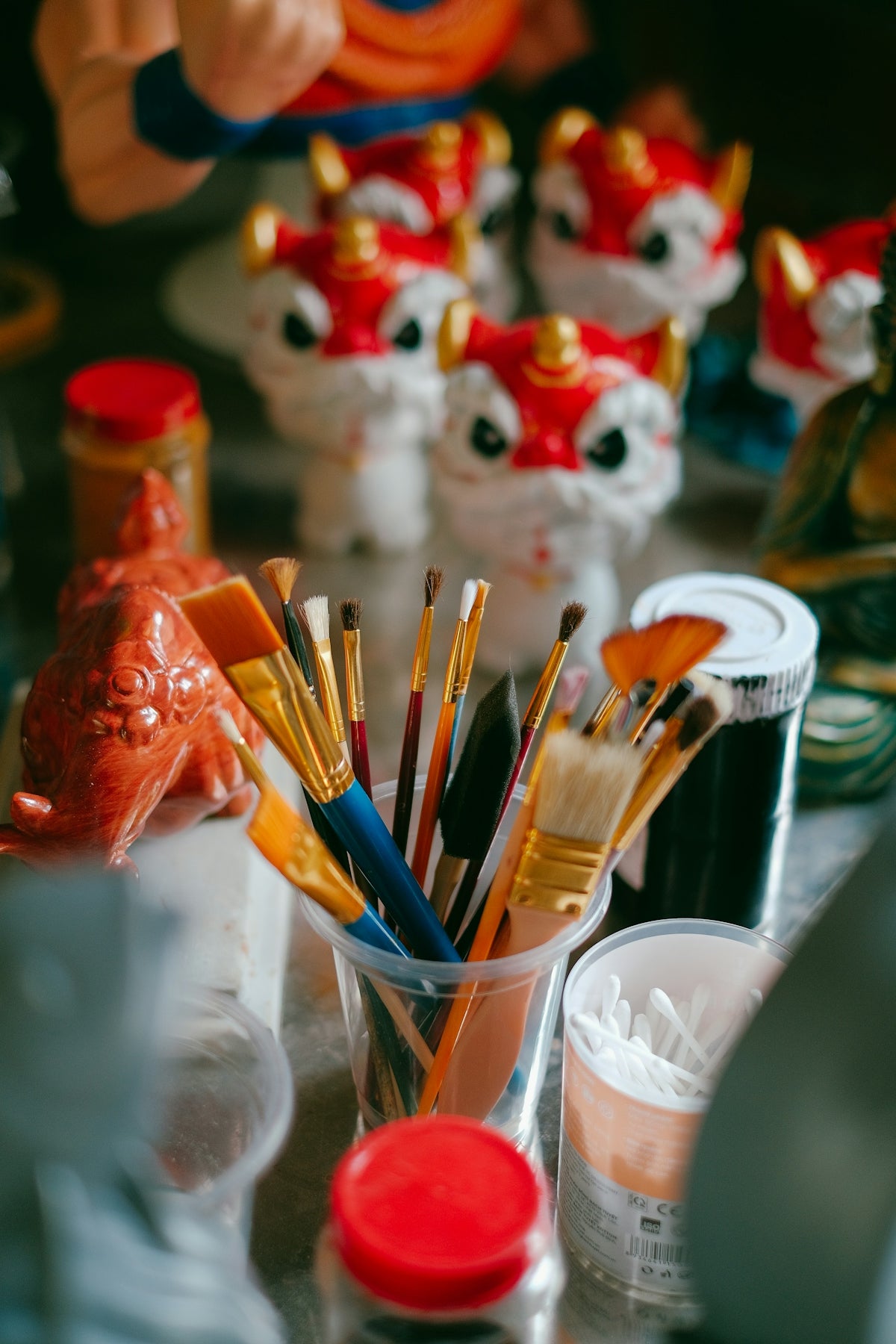 a table topped with lots of different types of paint