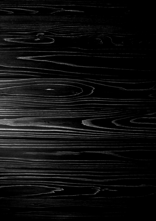 A black and white photo of a wooden floor